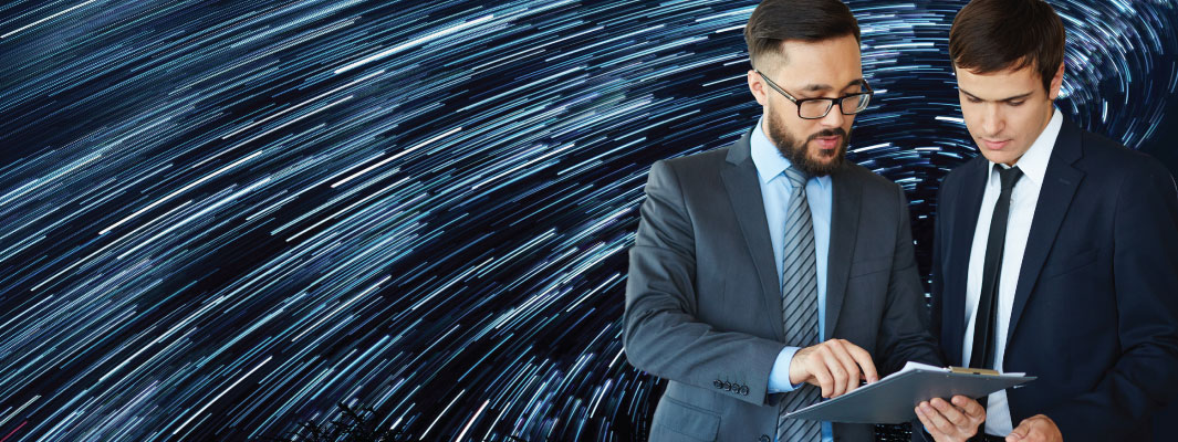 Two businessmen looking at a clipboard with an abstract background.